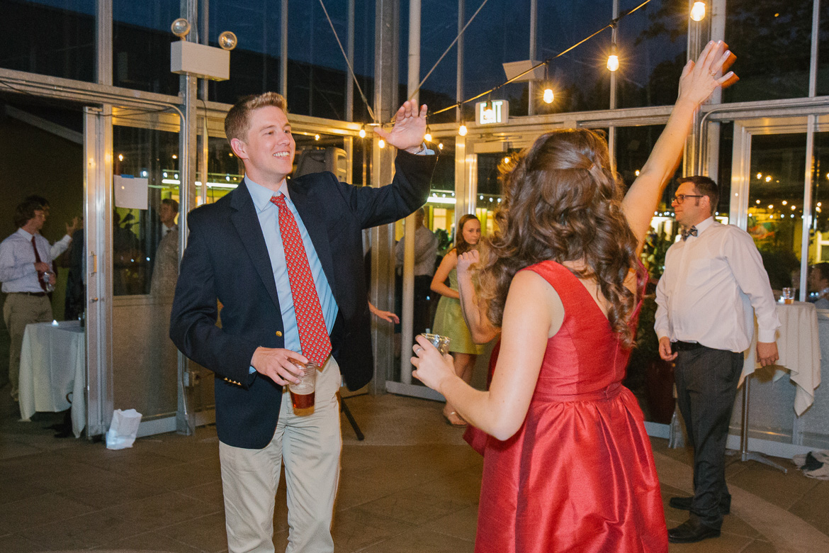 Guests dancing at wedding reception at Center for Urban horticulture in Seattle, WA