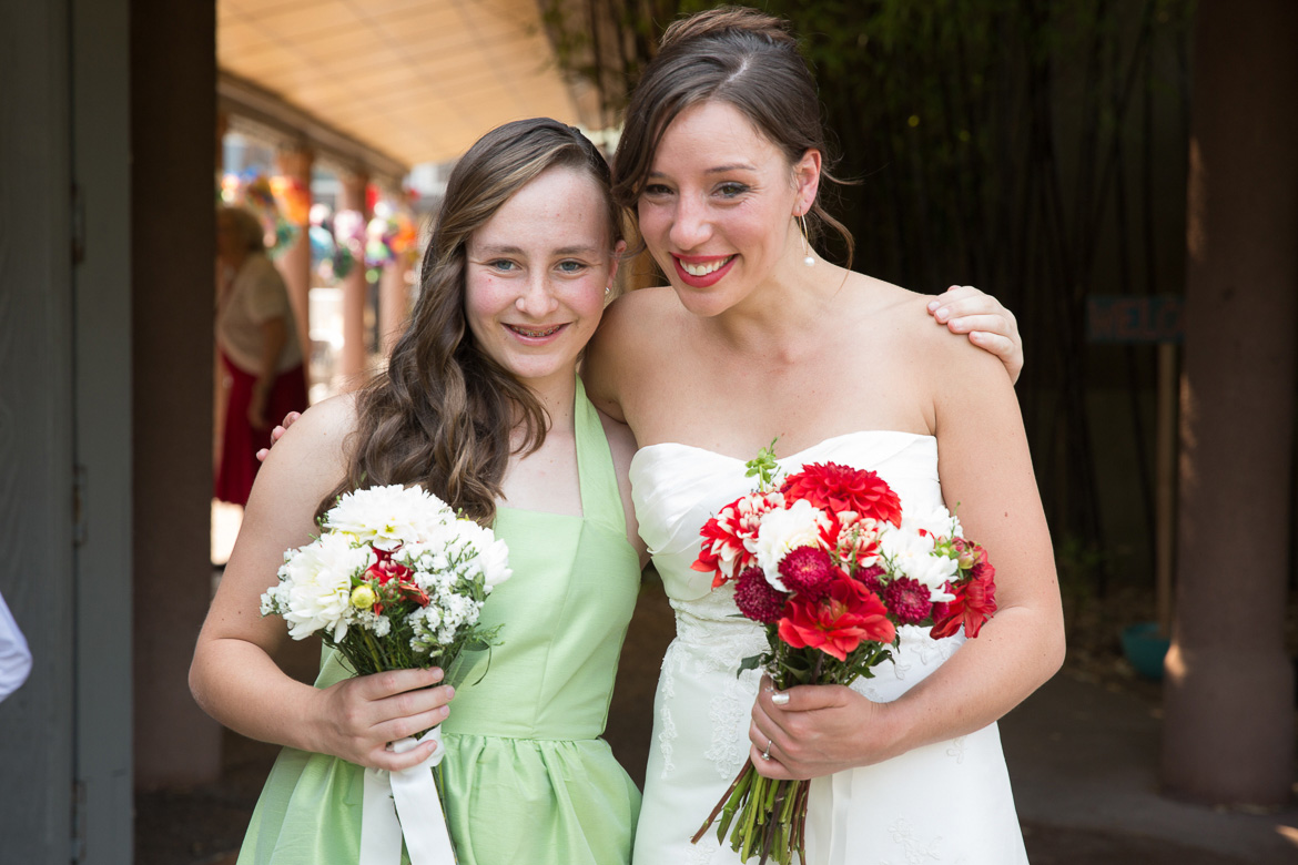 Bride and junior bridesmaid during portrait before wedding at Seattle Center for Urban Horticulture
