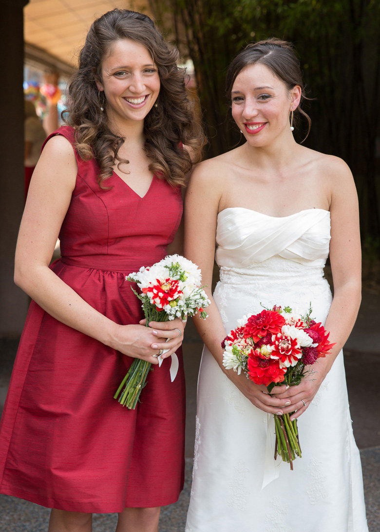 Bride and bridesmaid before wedding at Seattle Center for Urban Horticulure