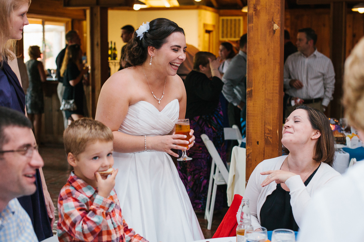 Bride laughing during cocktail hour at Kiana Lodge wedding in Poulsbo, WA