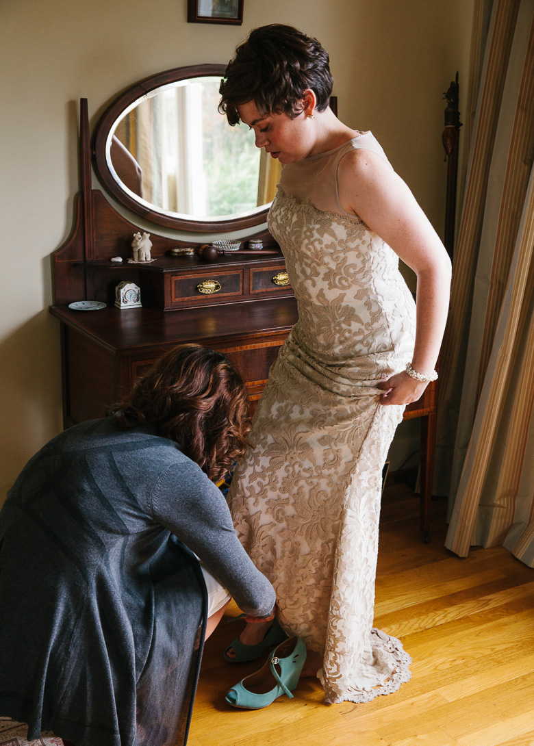 Bride putting on shoes for Seattle, Washington wedding