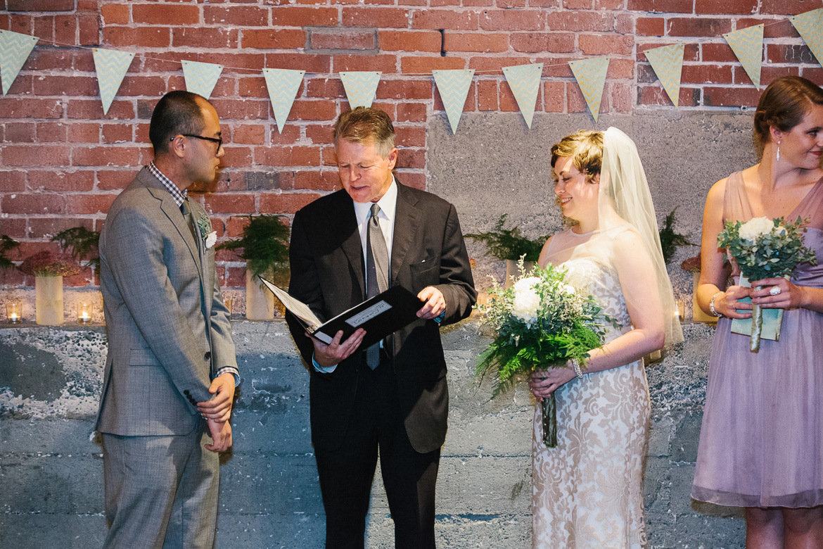 Bride and groom during wedding ceremony at Melrose Market Studios