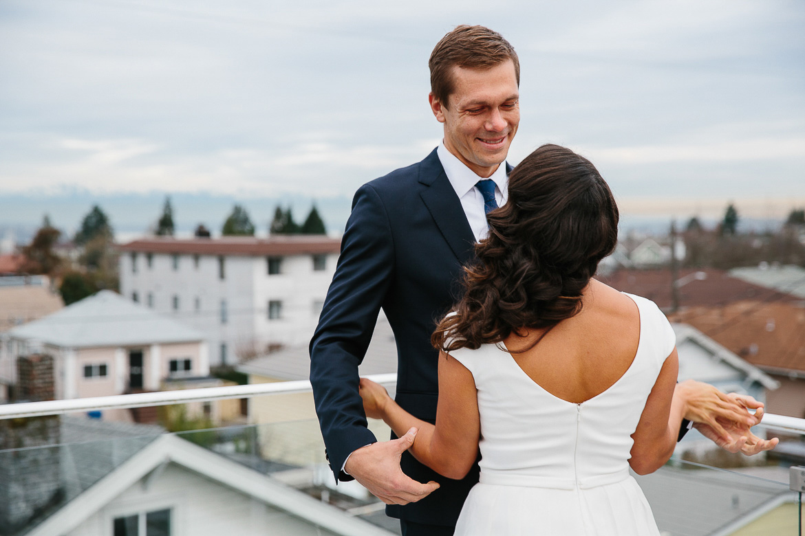 Groom looking at bride during first look on Beacon Hill for Seattle elopement