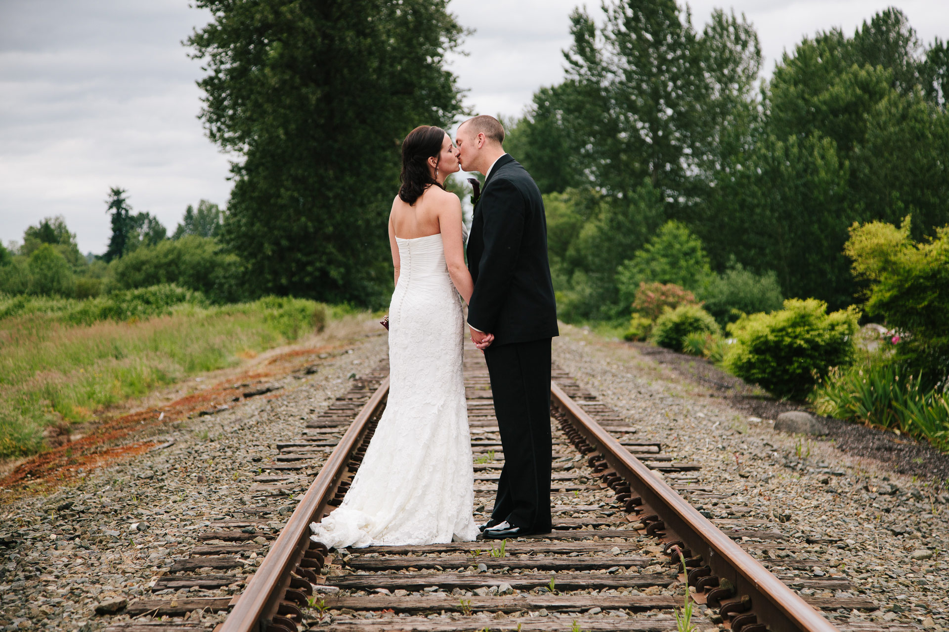 Bride and groom kissing at Hidden Meadows wedding during photography timeline