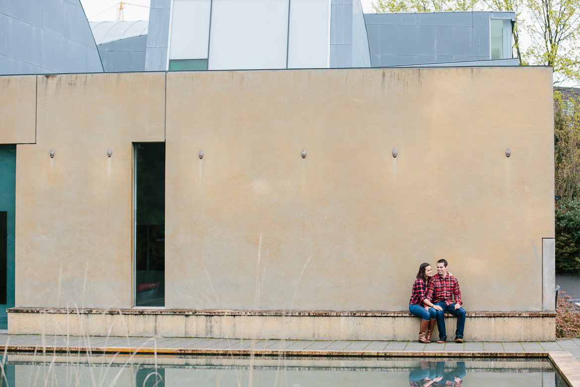 Couple in front of St Ignatius during engagement photos at Seattle University in Washington