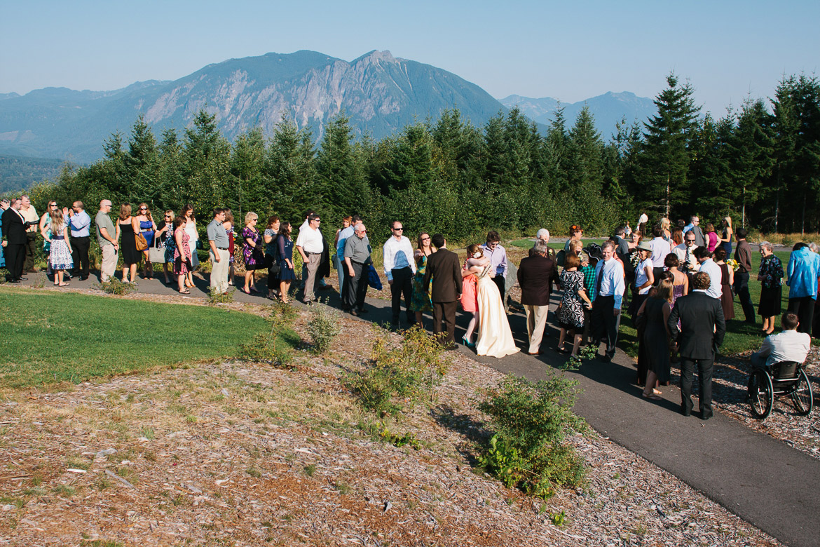 Recieving line after wedding ceremony at Snoqualmie Point Park with Cascade Mountain views