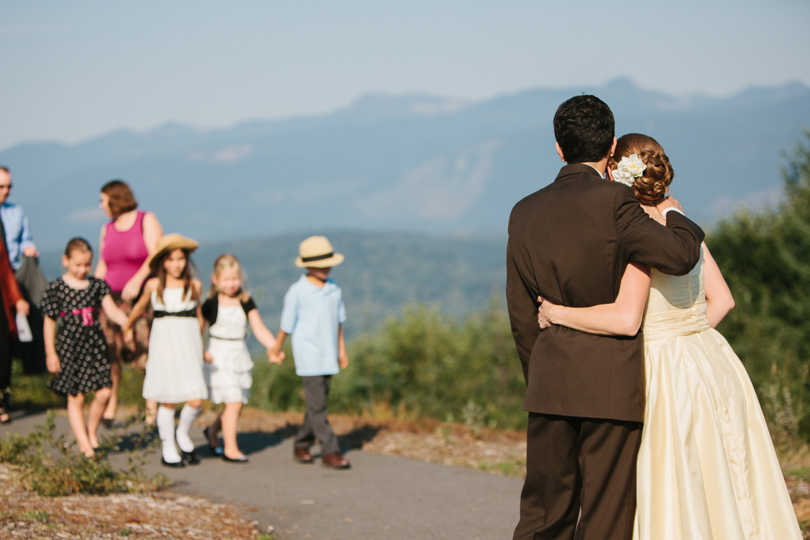 Bride and groom after wedding ceremony at Snoqualmie Point Park with Cascade Mountain views