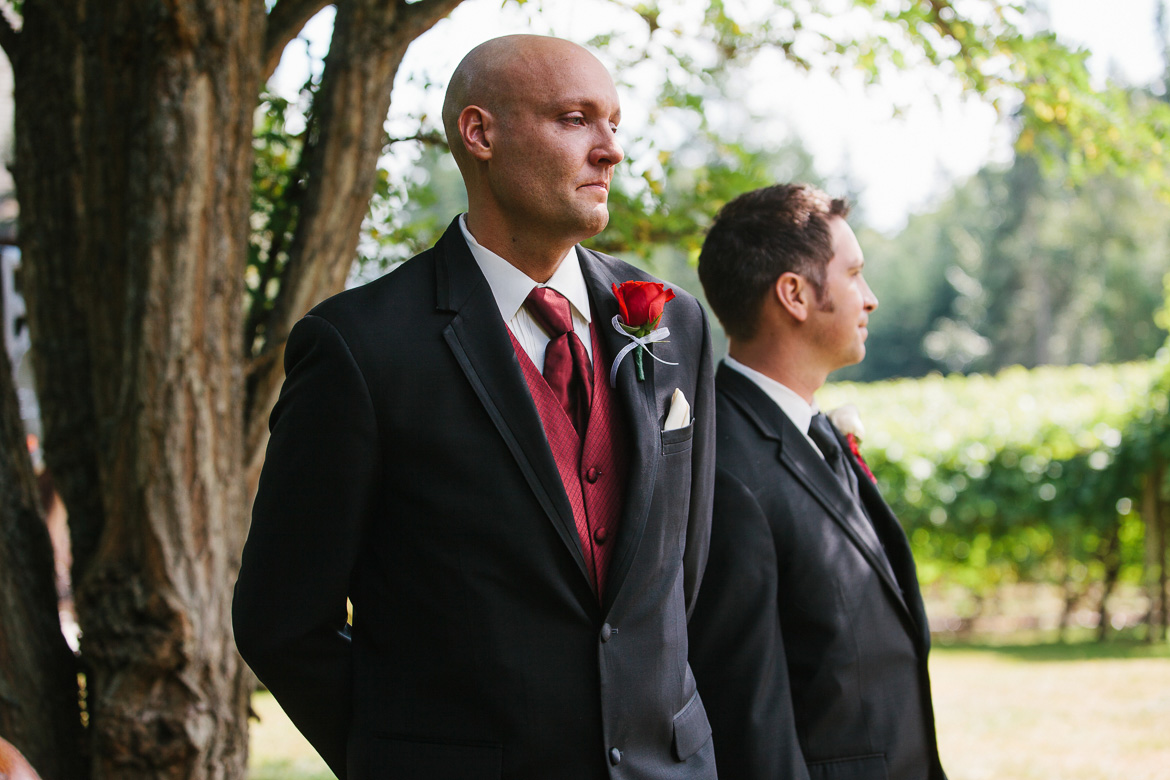Groom's reaction to bride coming down aisle for wedding at Whidbey Island Winery