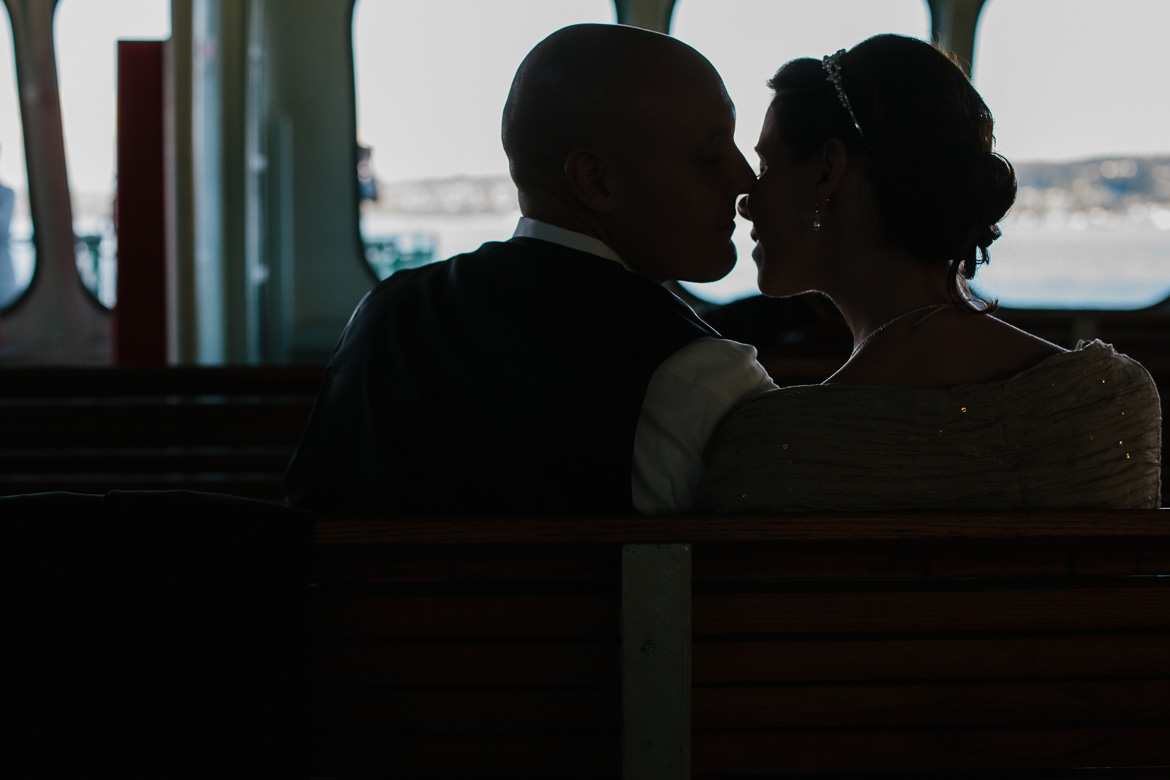Bride and groom on Washington ferry after Whidbey Island Winery wedding
