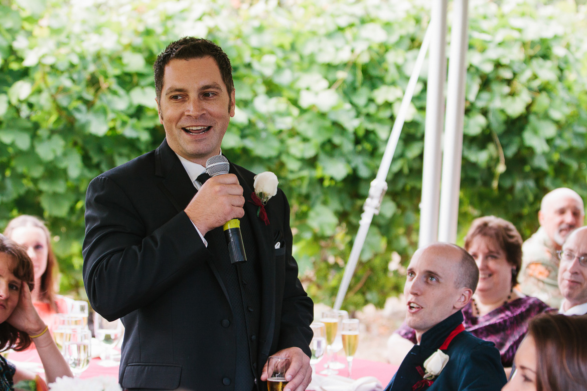 Groomsman giving toasts during wedding reception at Whidbey Island Winery