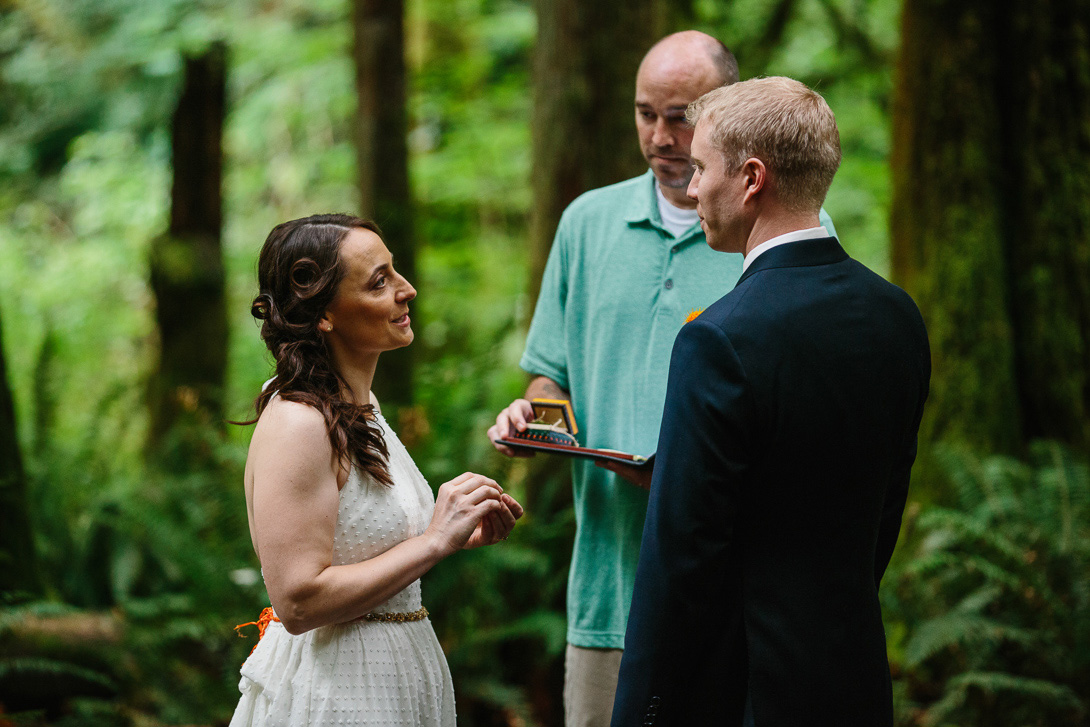 Bride with ring during forest wedding ceremony at Wallace Falls in Gold Bar, WA