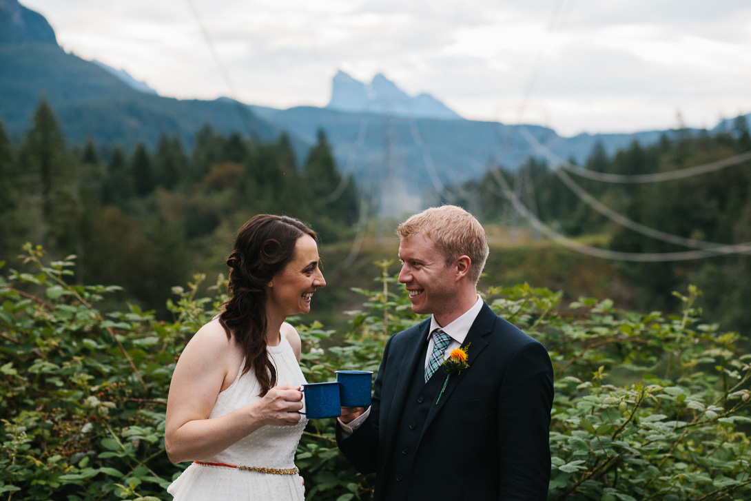 Bride and groom champagne toast during wedding portraits at Wallace Falls State Park in Gold Bar, WA