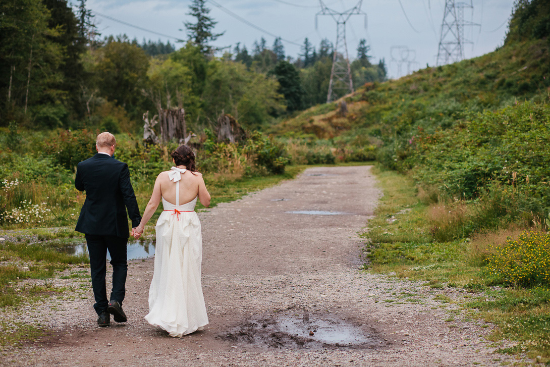 Bride and groom walking back to camp after wedding at Wallace Falls State Park in Gold Bar, WA