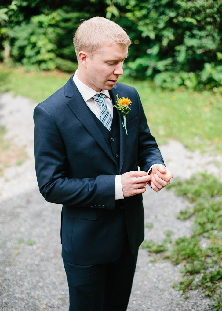 Groom getting ready before wedding ceremony at Wallace Falls State Park in Gold Bar, WA