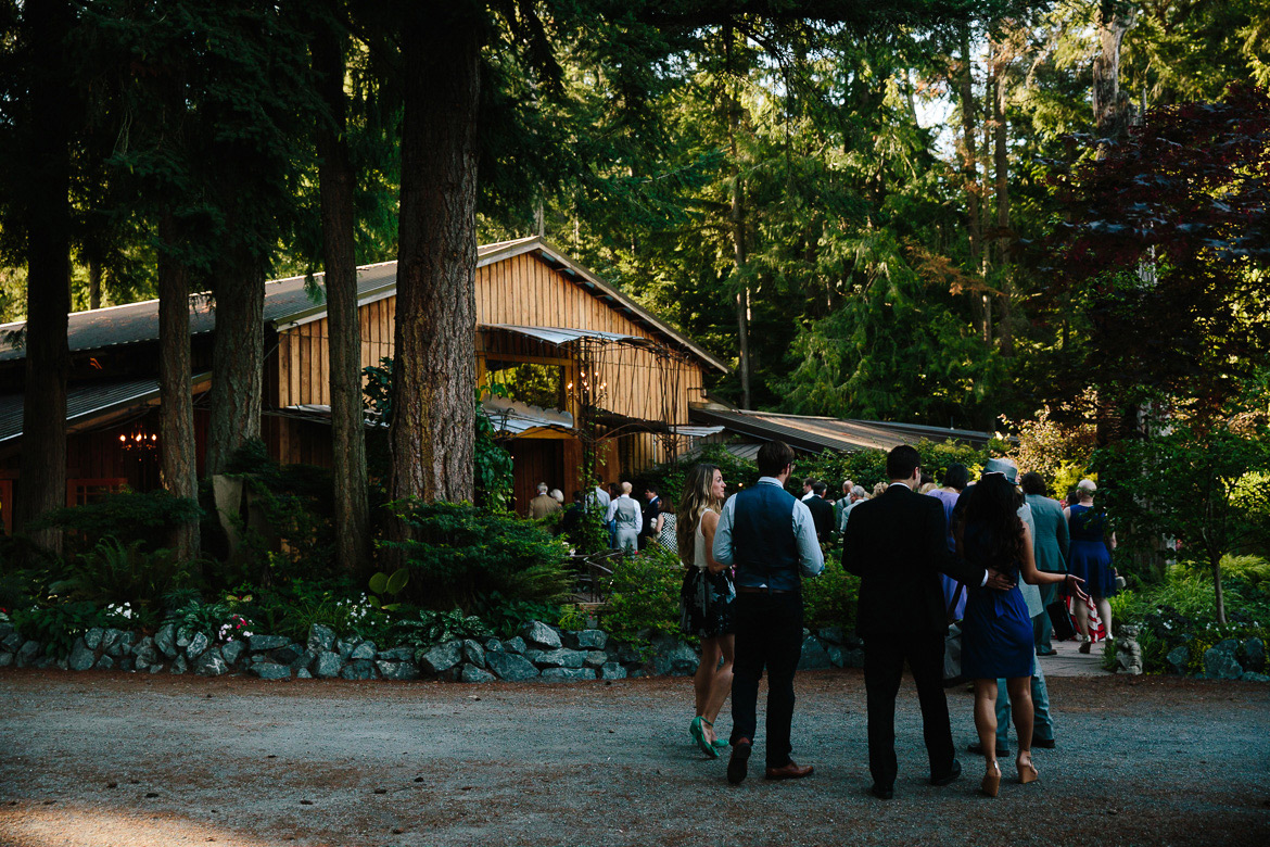 Guests going in for dinner at Fireseed Catering wedding on Whidbey Island, WA captured by a second photographer