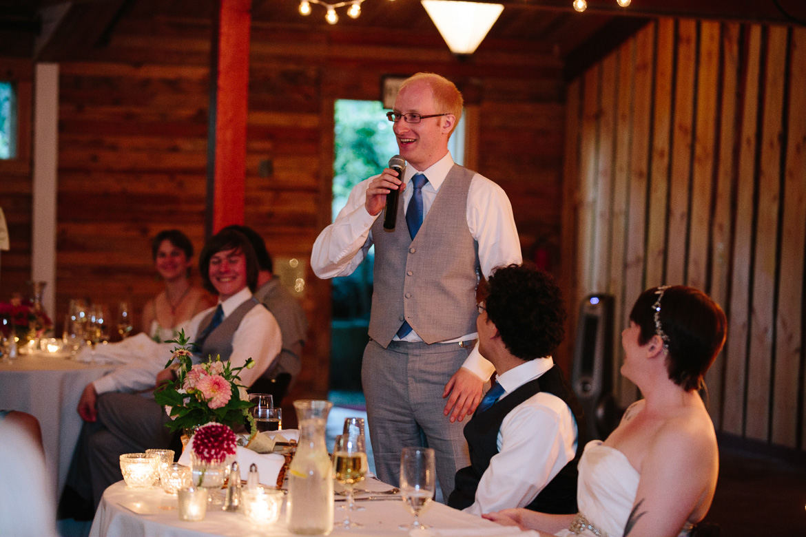 Best man giving toast during wedding reception at Fireseed Catering on Whidbey Island, WA