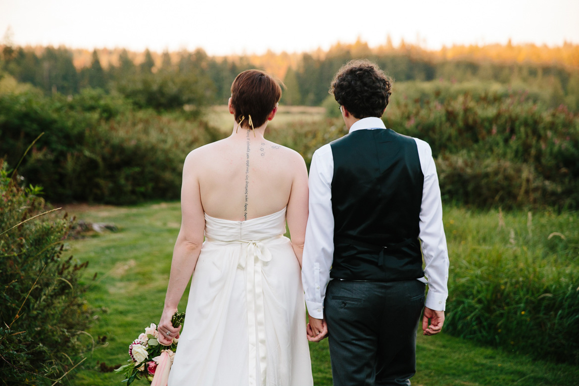 Bride and groom walking during sunset at Fireseed Catering wedding on Whidbey Island, WA