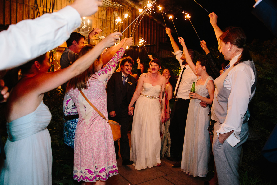 Bride and groom during sparkler exit at Fireseed Catering wedding on Whidbey Island, WA