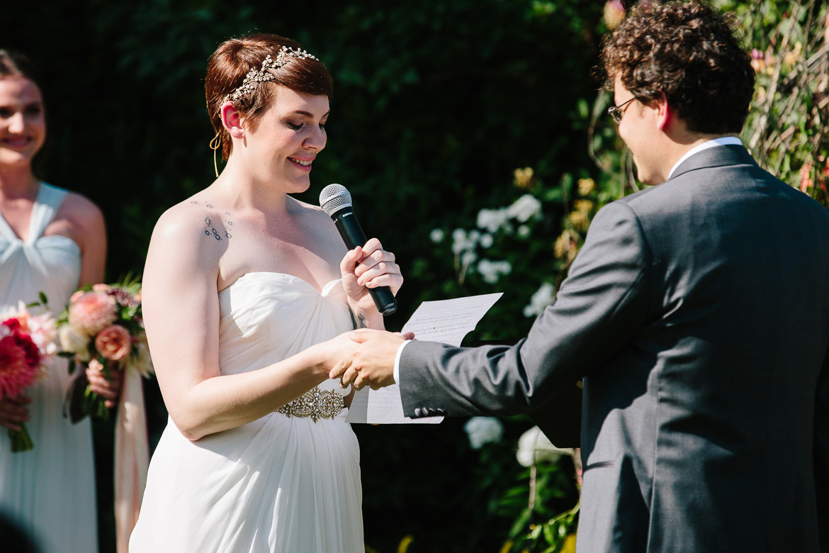 Bride saying vows during wedding ceremony at Fireseed Catering on Whidbey Island, WA