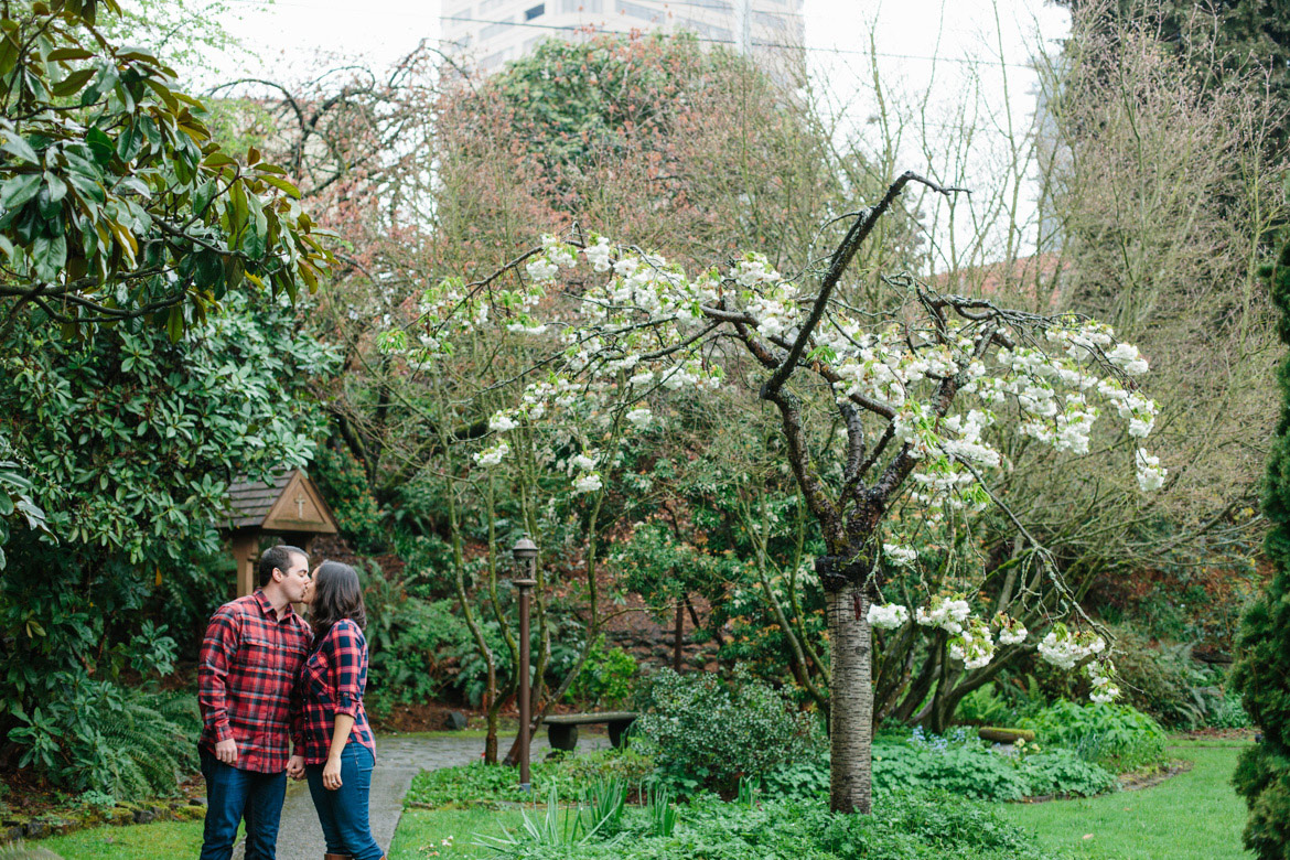 Couple kissing during engagement photos at Seattle University in Washington