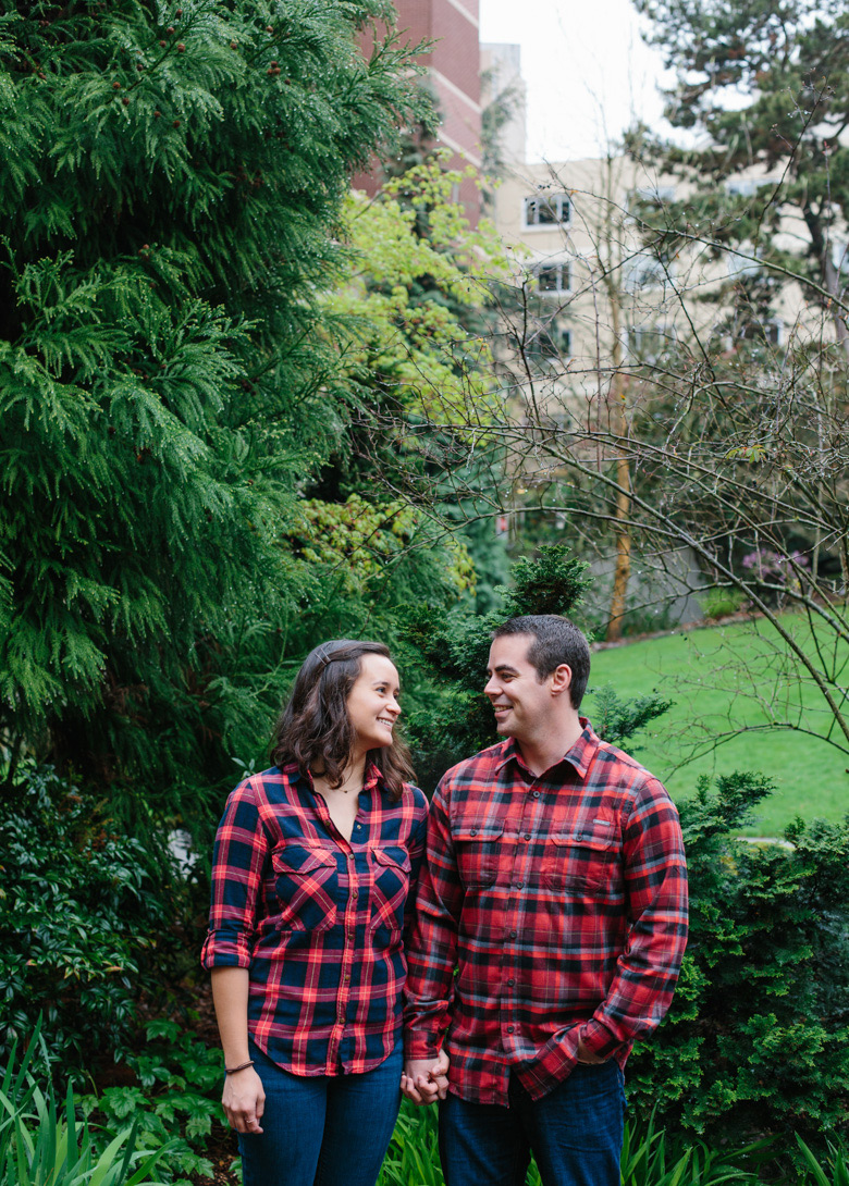 Couple laughing during engagement photos at Seattle University in Washington