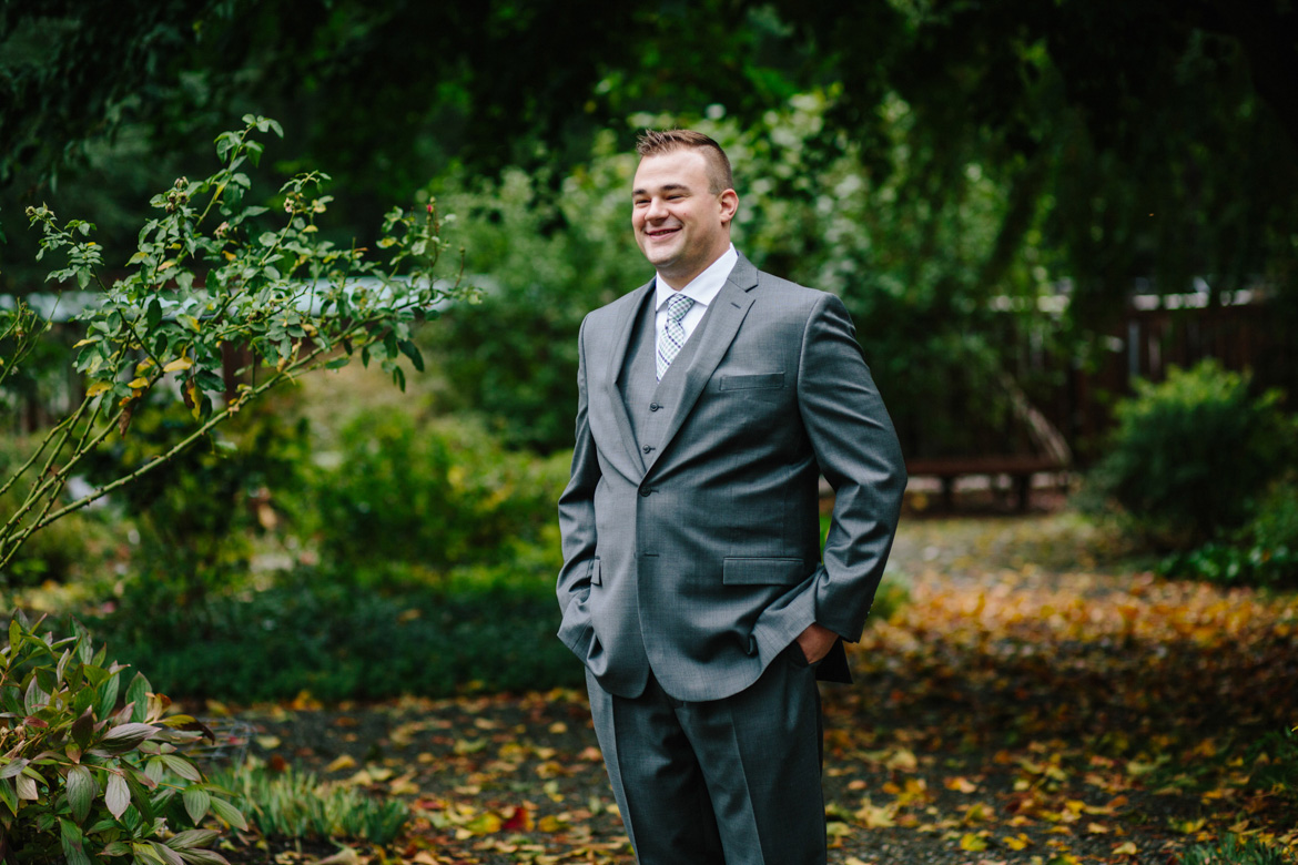 Groom during portraits before wedding at Lake Wilderness Lodge in Maple Valley, WA