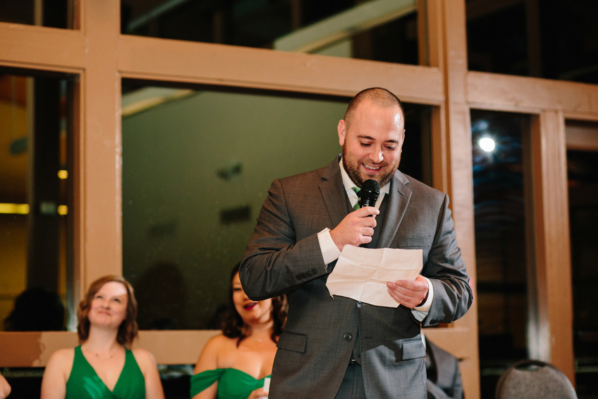 Groomsman during wedding toast at reception at Lake Wilderness Lodge in Maple Valley, WA