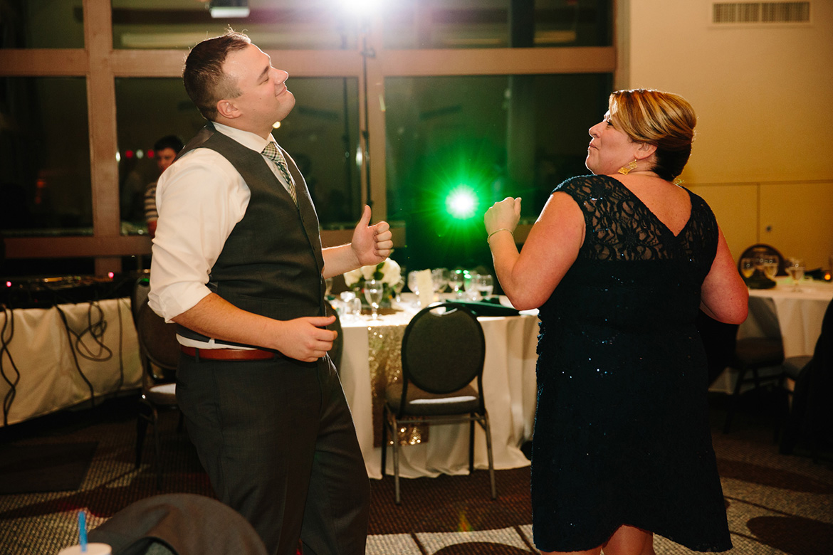 Groom and mom dancing during wedding reception at Lake Wilderness Lodge in Maple Valley, WA