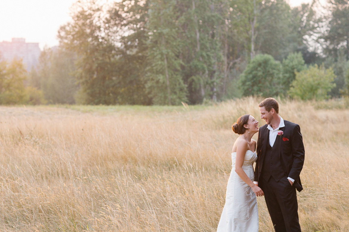 Bride and groom in field during sunset portraits at Center for Urban Horticulture in Seattle, WA