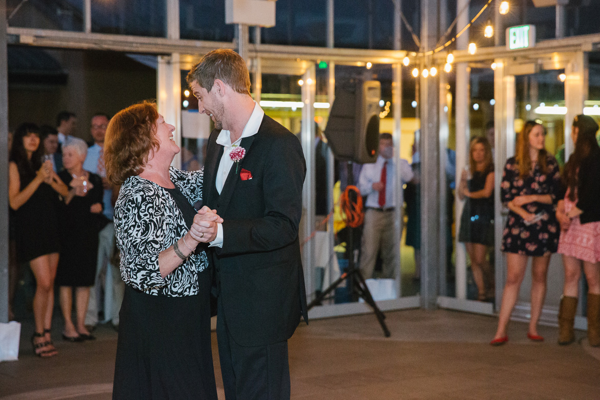 Mother son first dance during wedding reception at Center for Urban Horticulture in Seattle, WA