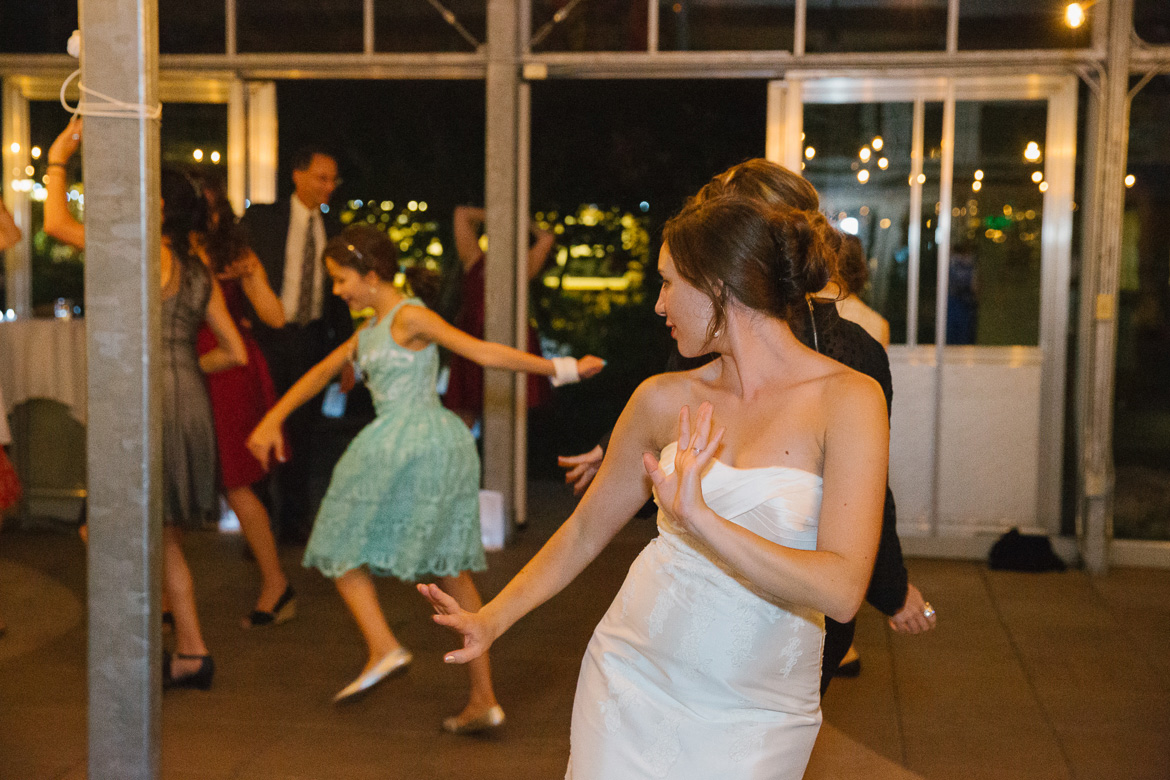 Bride dancing at wedding reception at Center for Urban horticulture in Seattle, WA