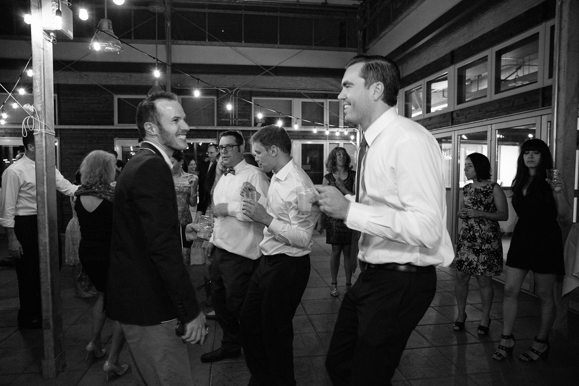 Guests dancing at wedding reception at Center for Urban horticulture in Seattle, WA