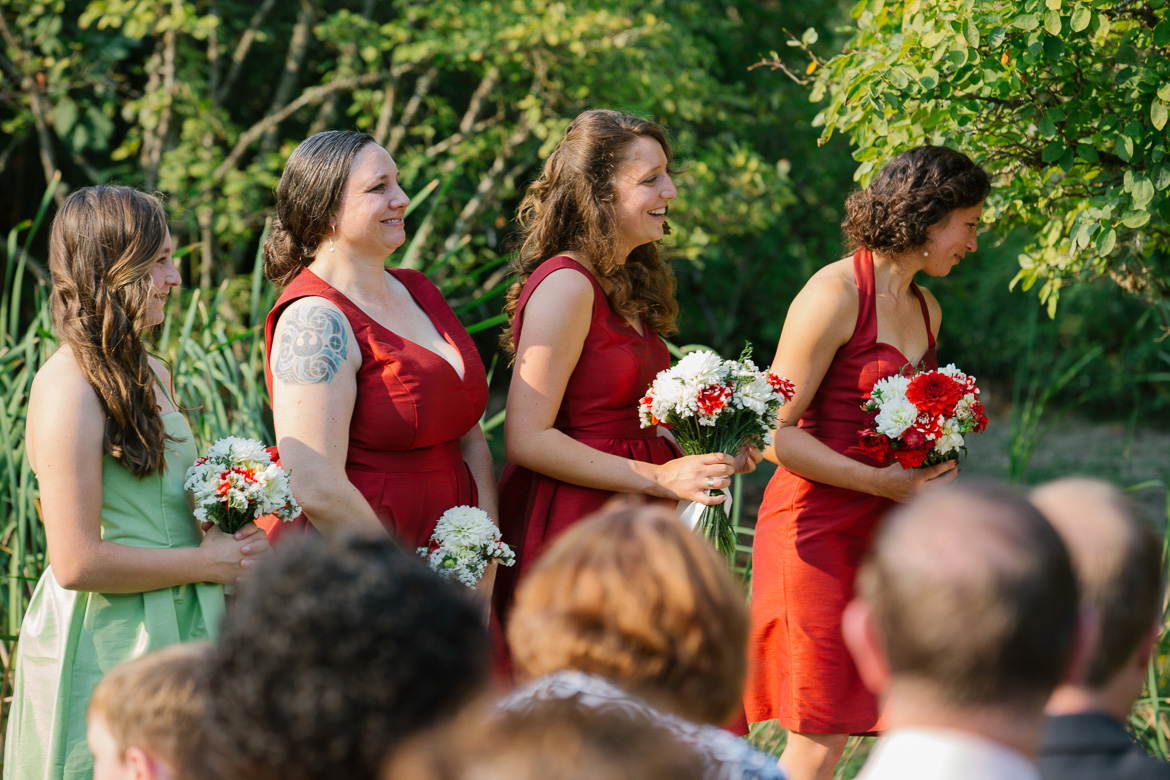 Bridesmaids during wedding ceremony at Center for Urban Horticulture in Seattle, WA