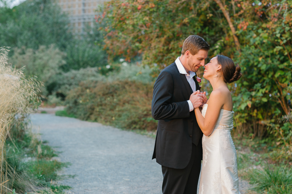 Bride and groom looking at each other during sunset portraits at Center for Urban Horticulture in Seattle, WA
