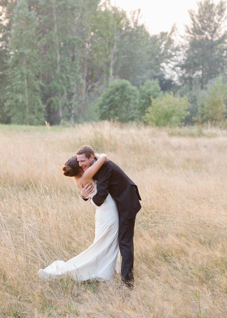 Groom hugging bride during sunset portraits at Center for Urban Horticulture in Seattle, WA