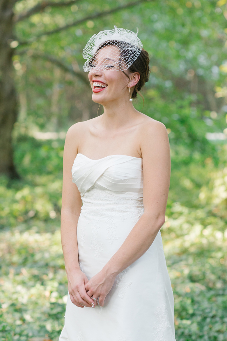 Bride laughing before wedding at Seattle Center for Urban Horticulture in Washington