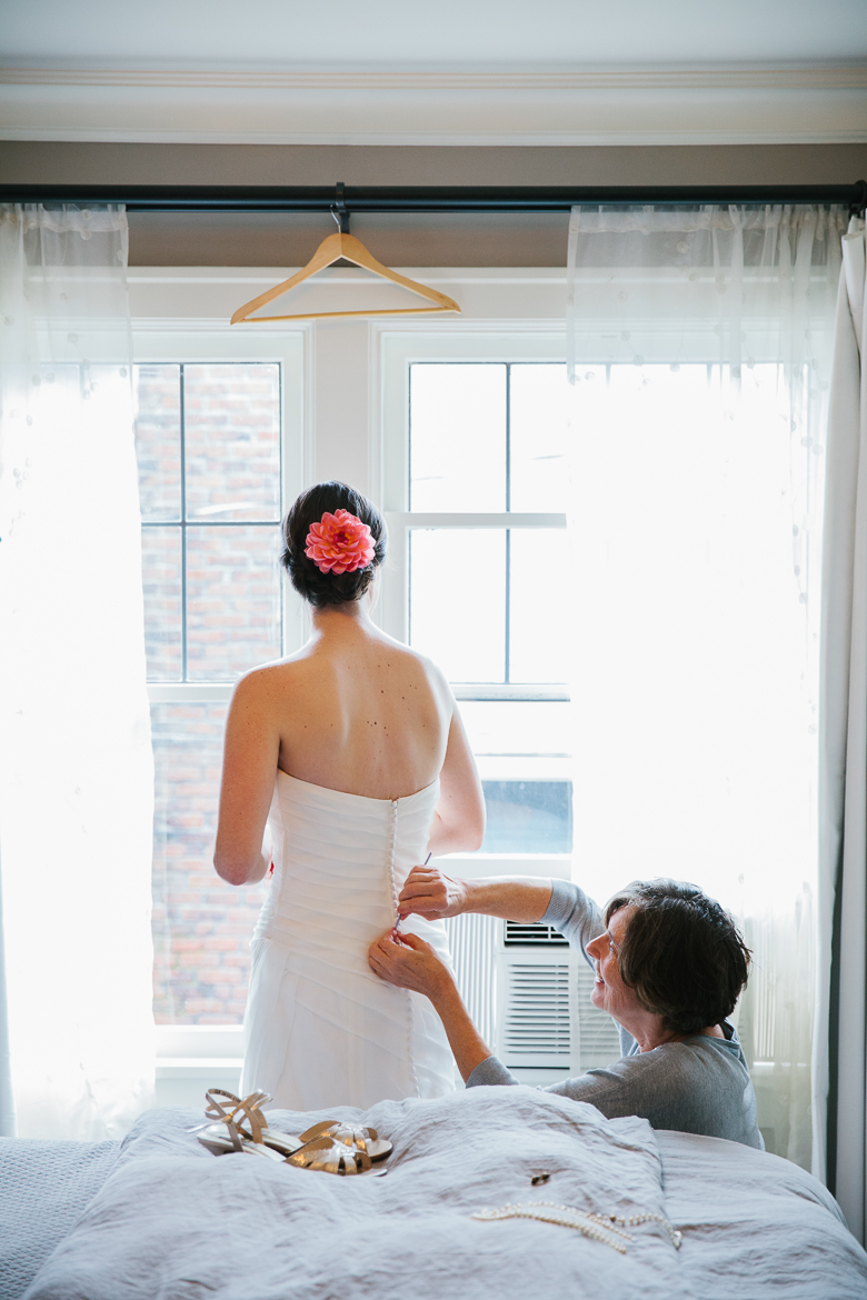 Bride getting ready for her Woodland Park Zoo wedding during photography timeline