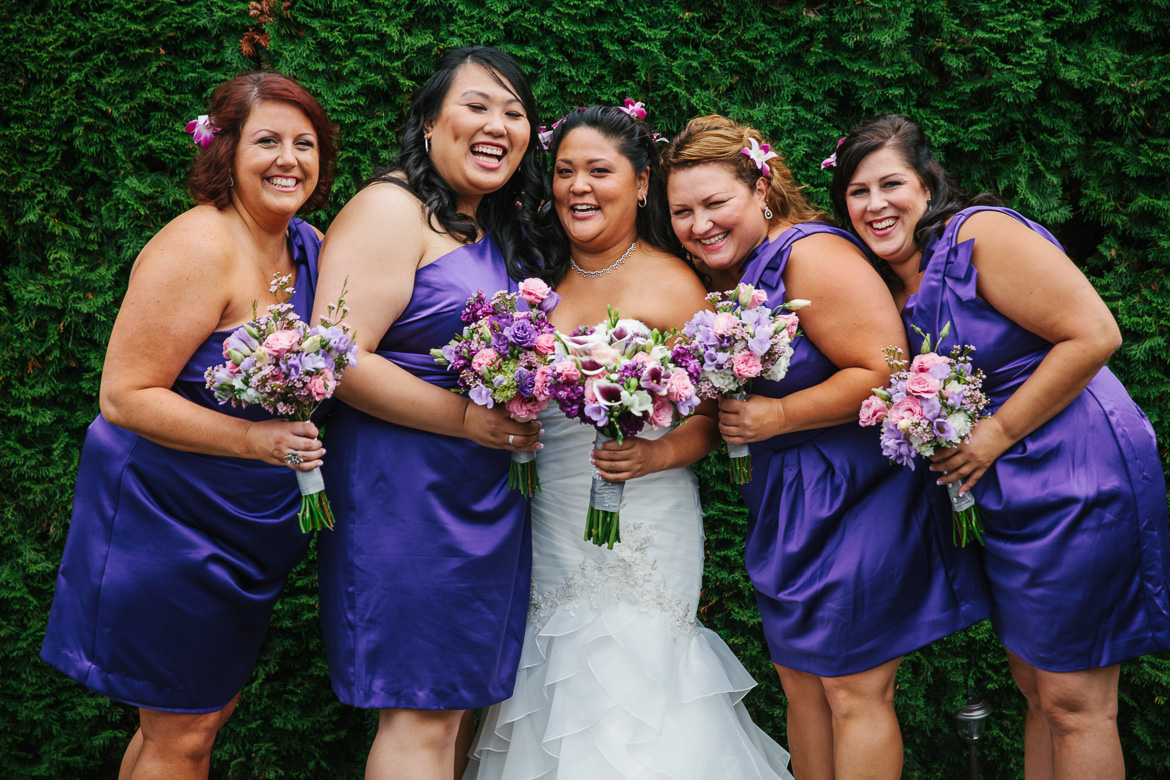 Bride and bridesmaid during portraits at Columbia Winery wedding in Woodinville