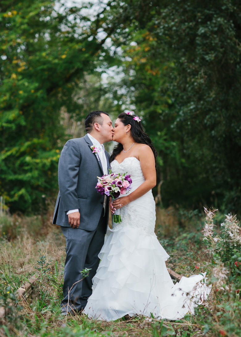 Bride and groom kissing during Columbia Winery wedding in Woodinville