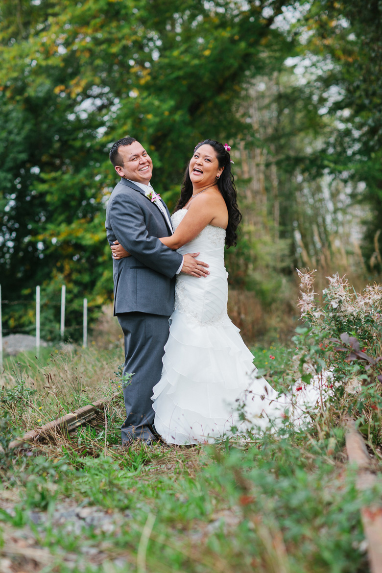 Bride and groom laughing during Columbia Winery wedding in Woodinville