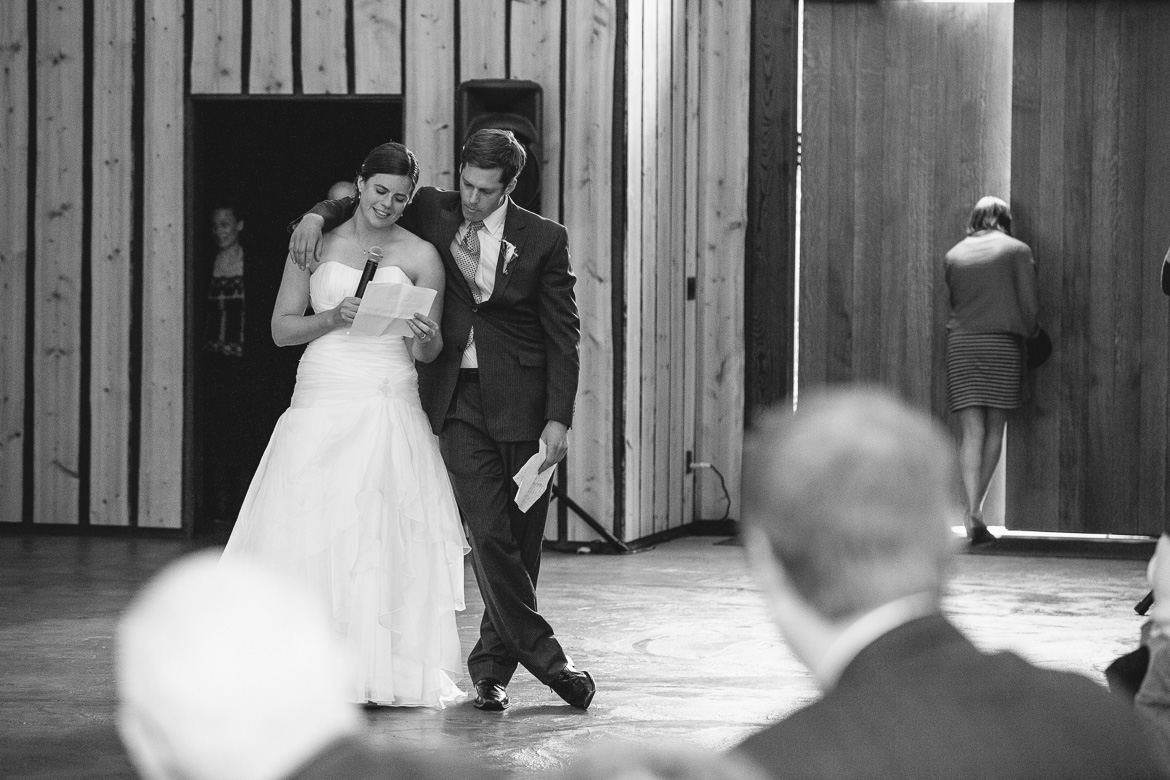 Bride and brother during toasts at Whidbey Island wedding at Fireseed Catering