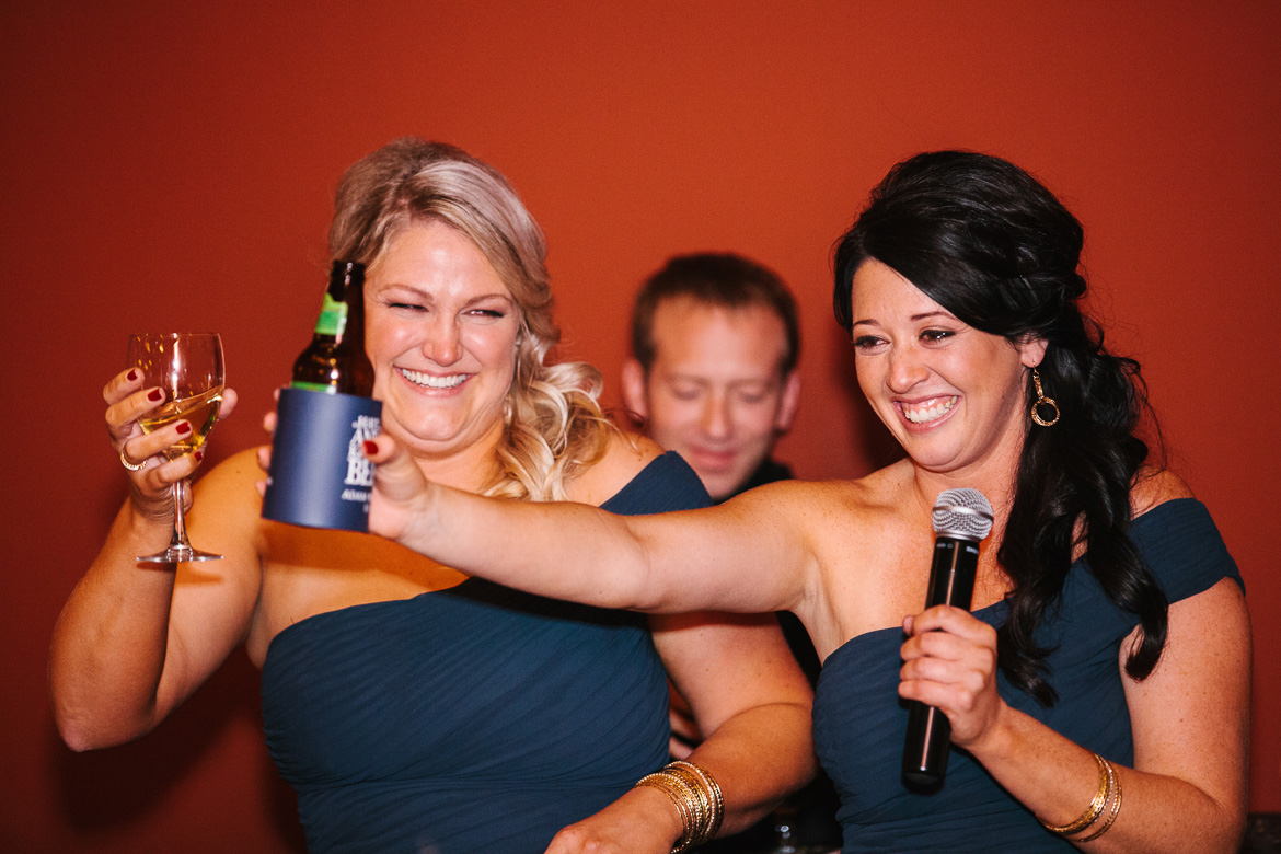 Bridesmaids laughing during toasts at Georgetown Ballroom wedding in Seattle, WA