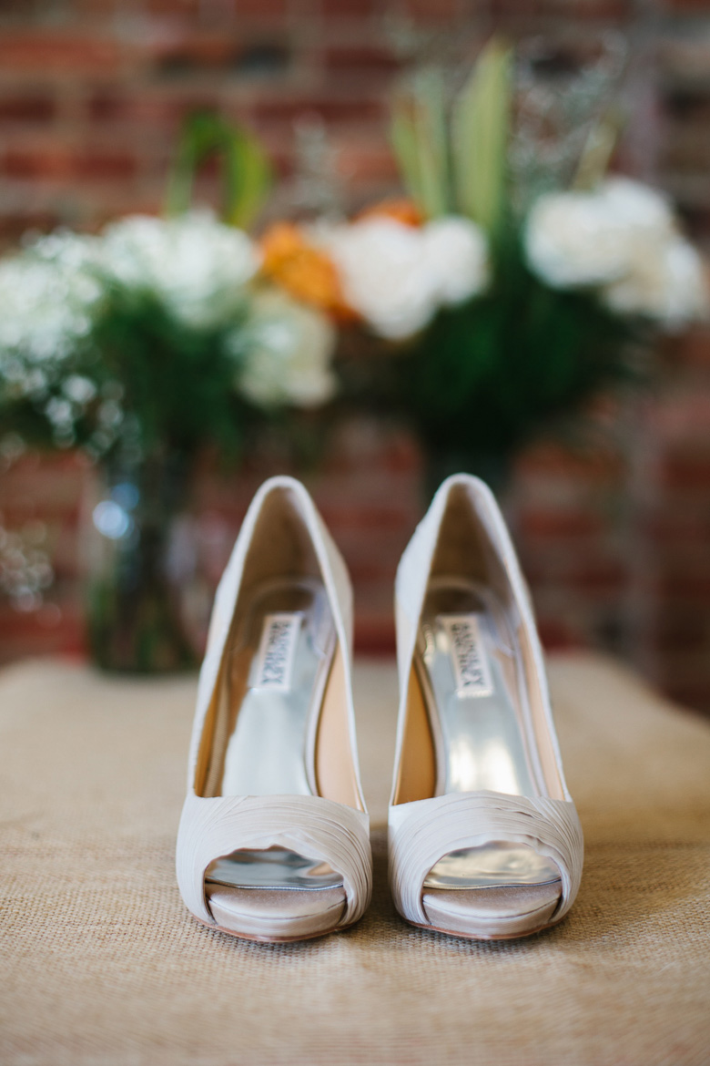 Bride's shoes for wedding at Golden Gardens Bathhouse in Seattle, WA during wedding photography coverage