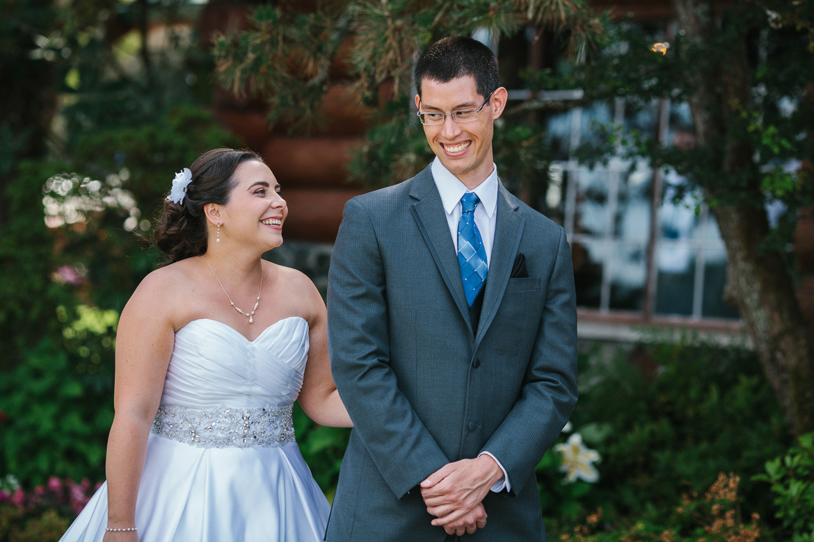 Bride and groom during first look before wedding at Kiana Lodge in Poulsbo, WA