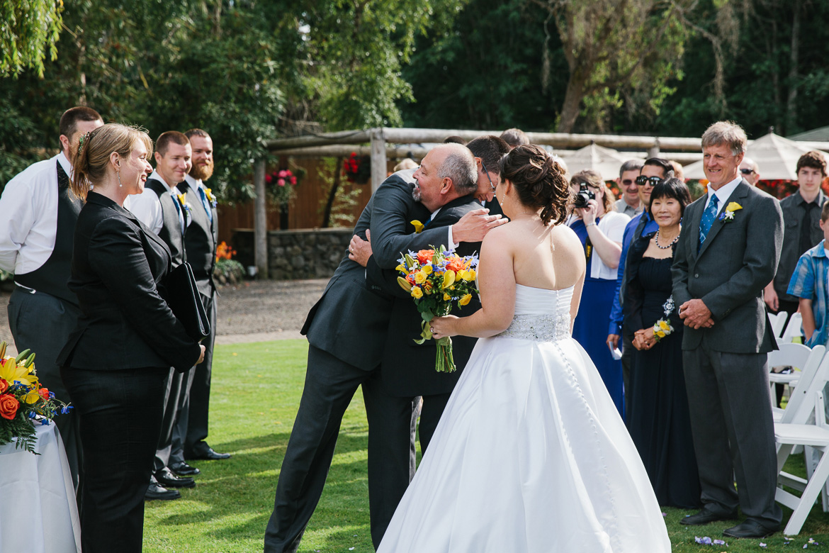 Bride and groom during wedding ceremony at Kiana Lodge in Poulsbo, WA