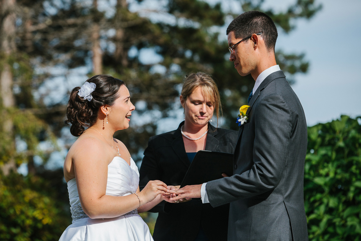 Bride and groom during vows at wedding ceremony at Kiana Lodge in Poulsbo, WA