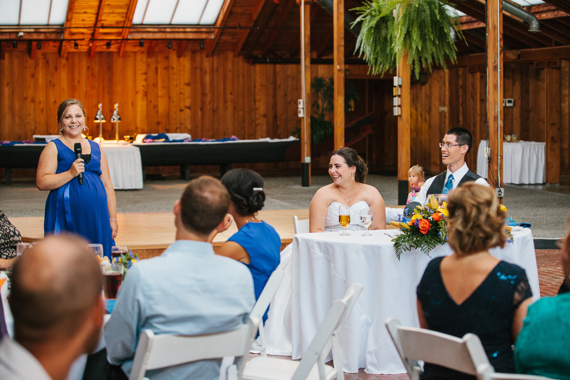 Maid of honor, bride and groom during reception toasts at Kiana Lodge wedding in Poulsbo, WA