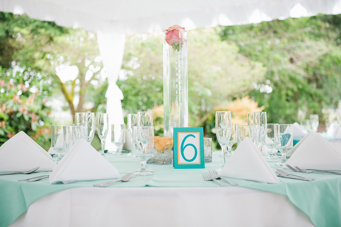 Reception table flower and number detail at summer wedding at Laurel Creek Manor