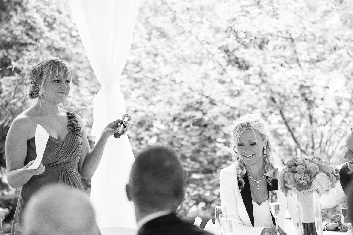 Bridesmaid giving toast during reception at Laurel Creek Manor summer wedding