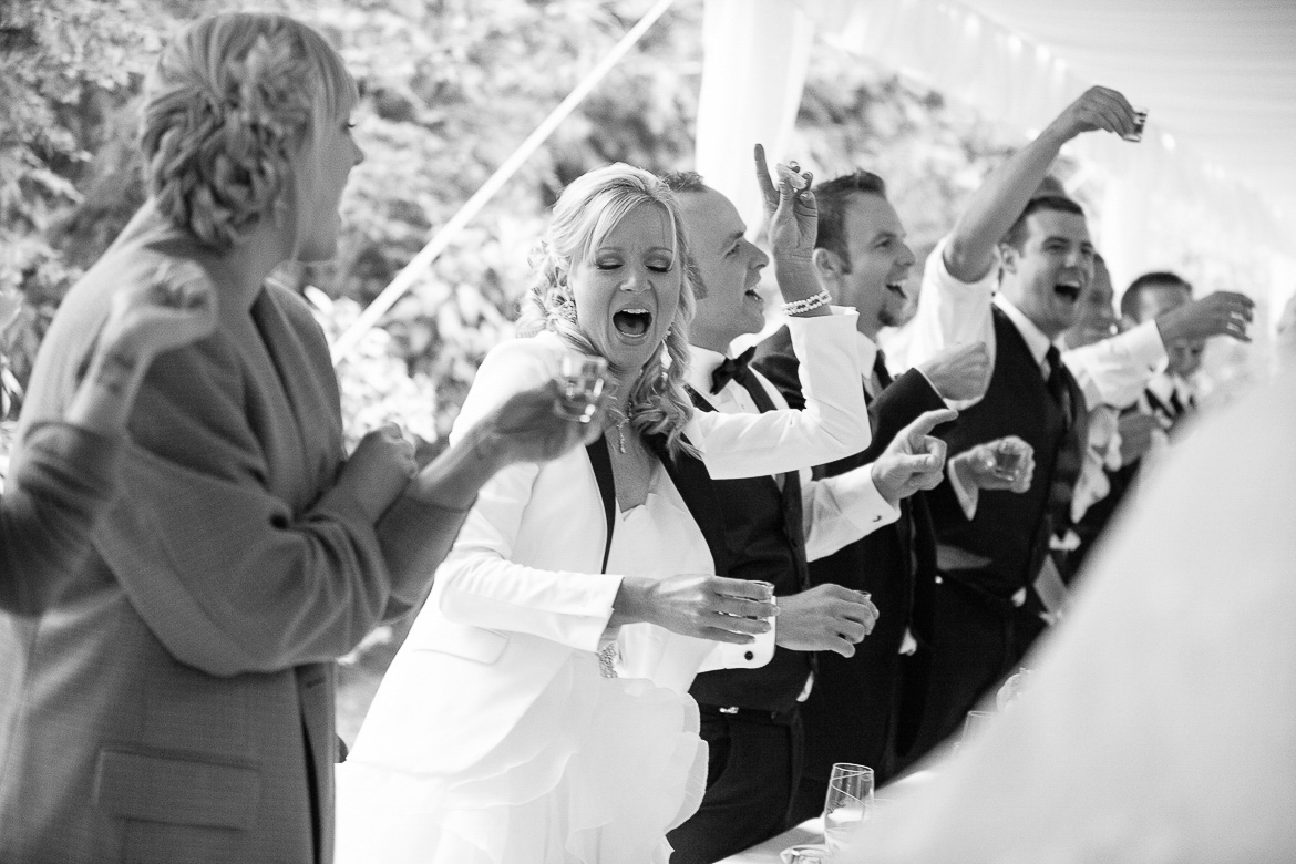 Bride during tequila toast during wedding reception at Laurel Creek Manor in Sumner, WA